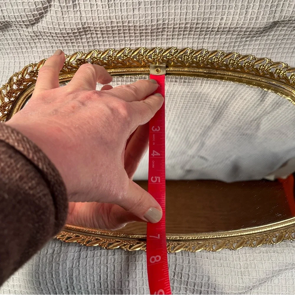 Vintage gold tone filigree vanity mirror